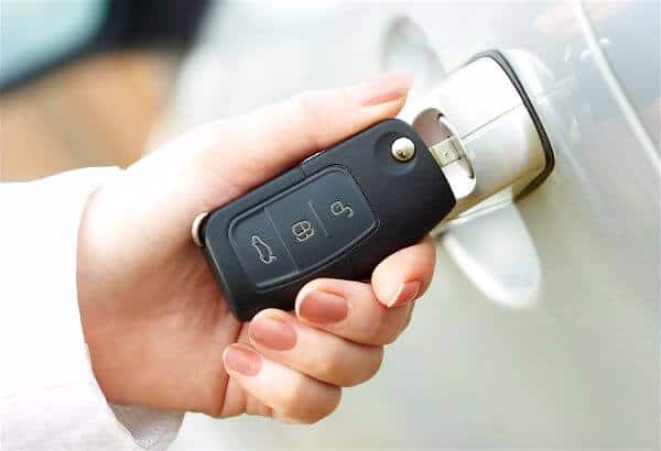 Man opening car with remote key